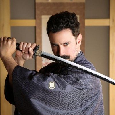 Adar Bronstein in samurai attire holding a katana